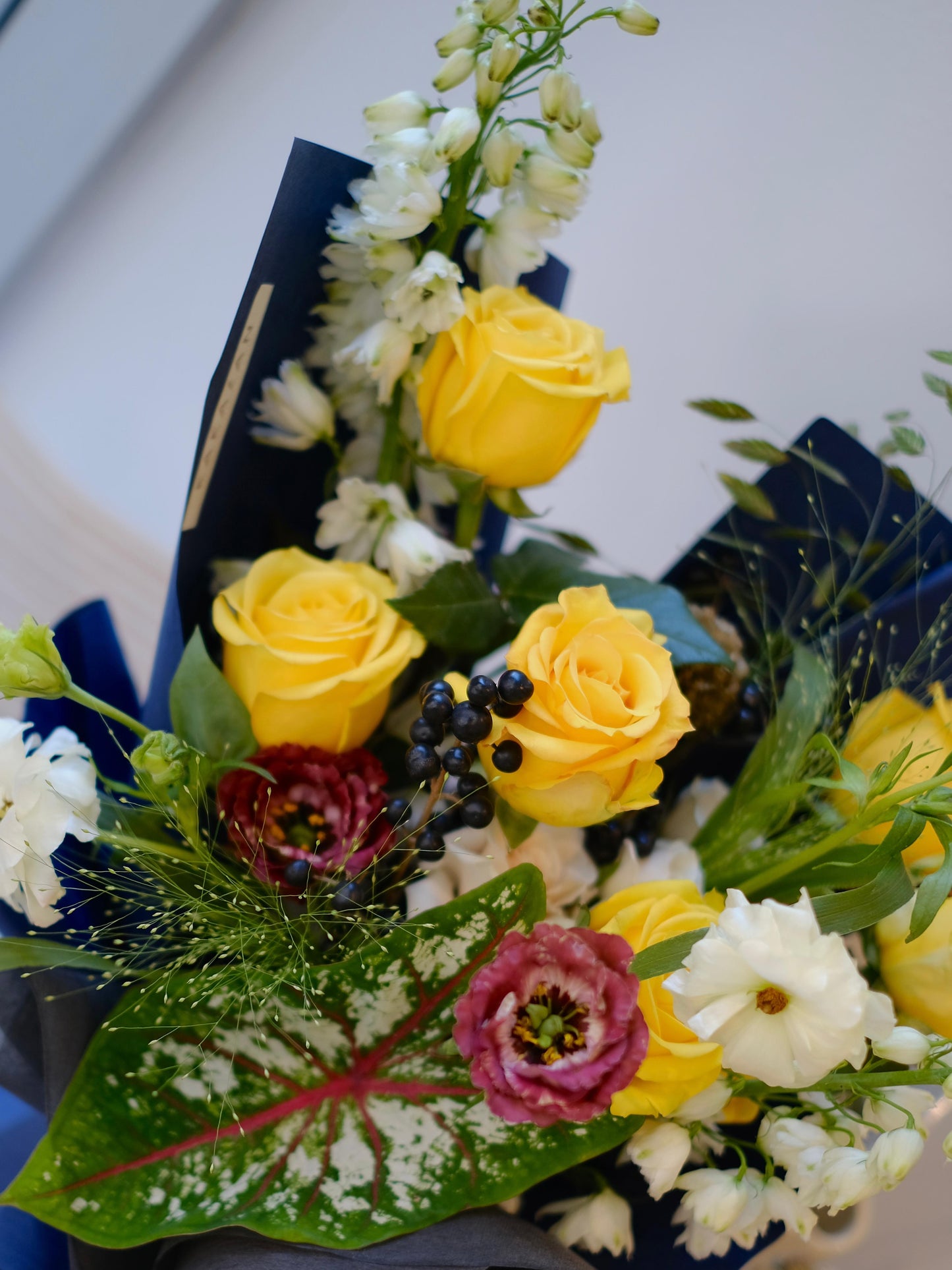 Yellow Rose korean bouquet wrapped with blue paper