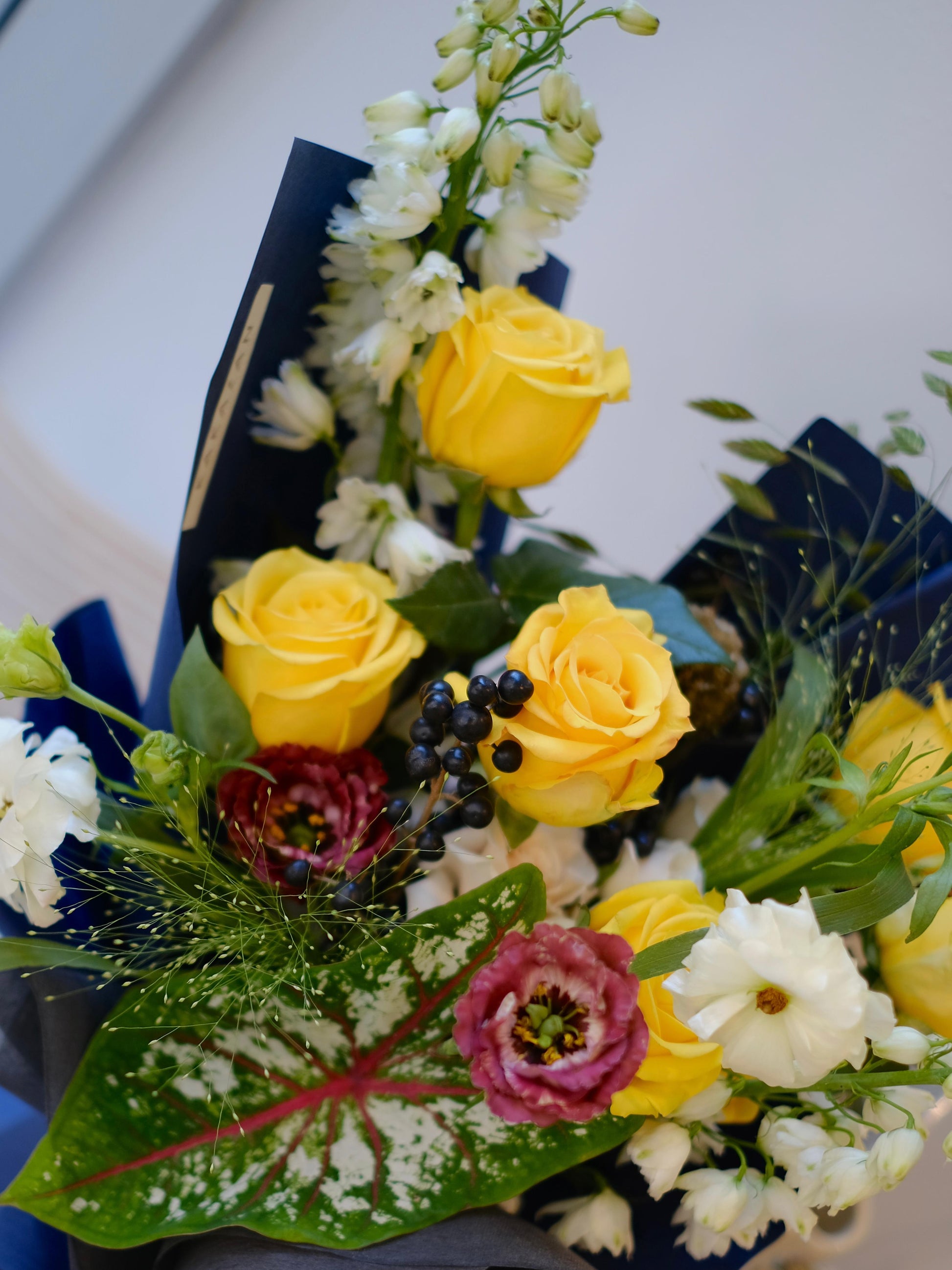Yellow Rose korean bouquet wrapped with blue paper