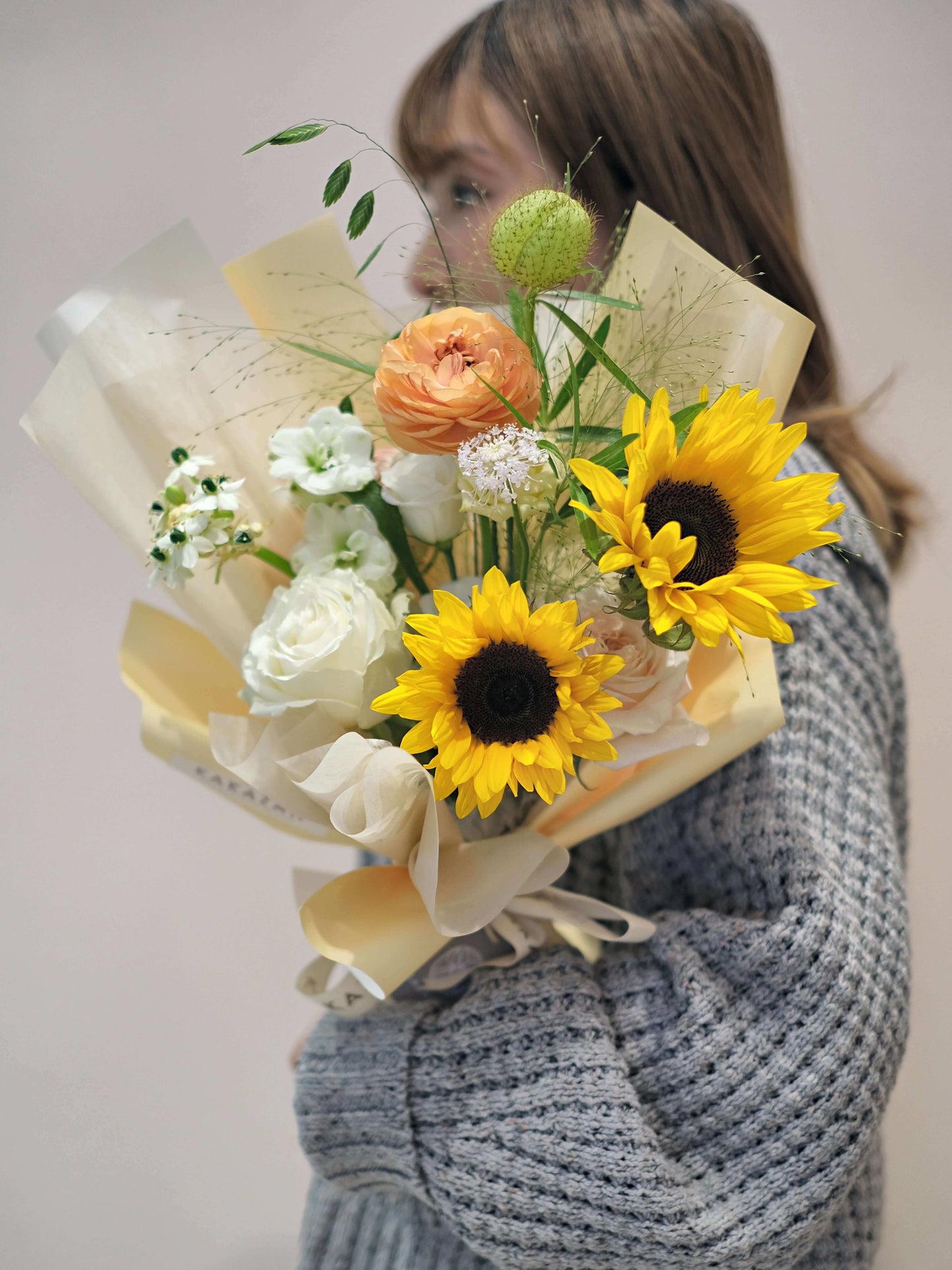 Girl holding sunflowers