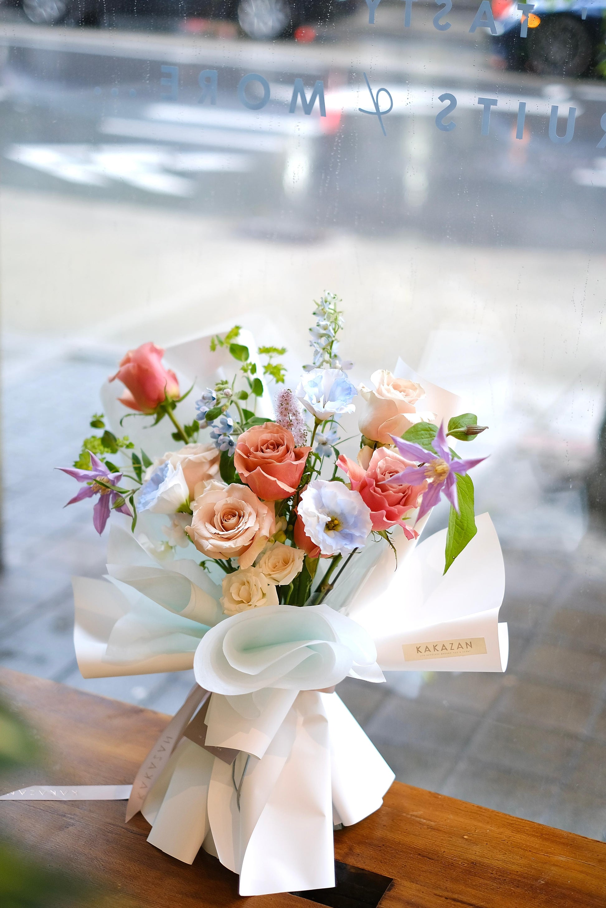 Rose Bouquet in toronto, with soft Greenery and Peach Roses.