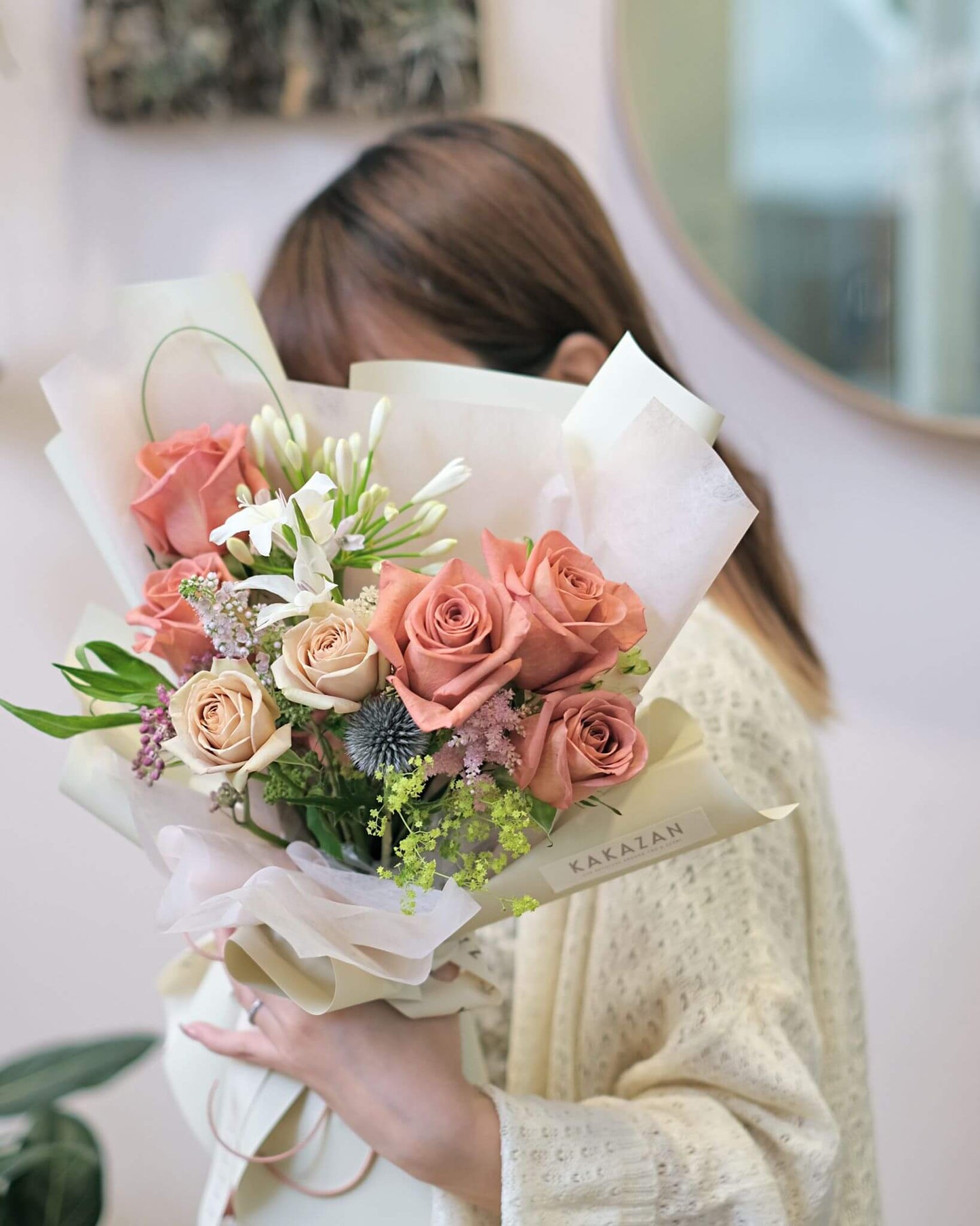 A girl holding bouquet