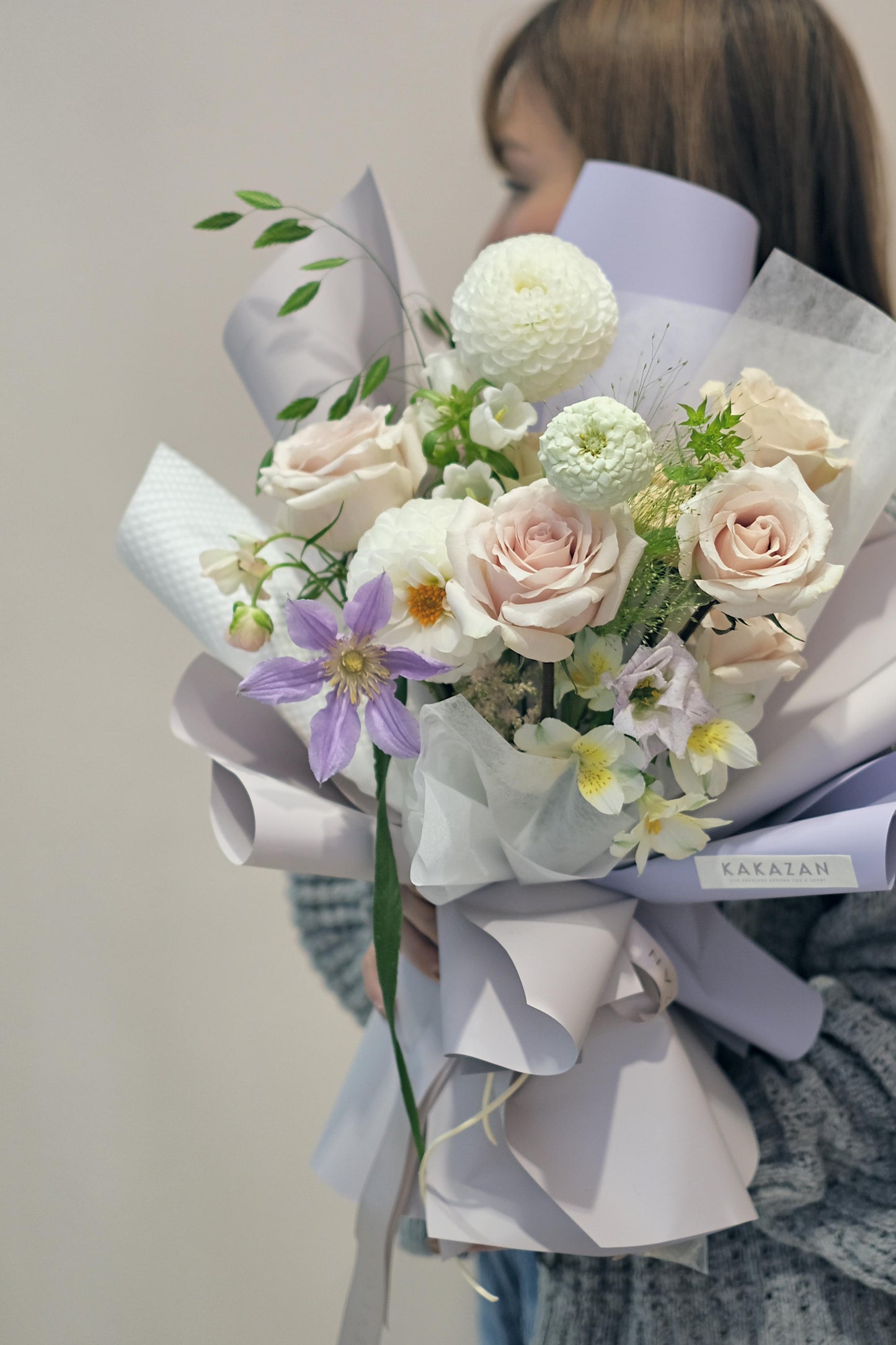 A Girl holding Korean Style Pastel Color Bouquet