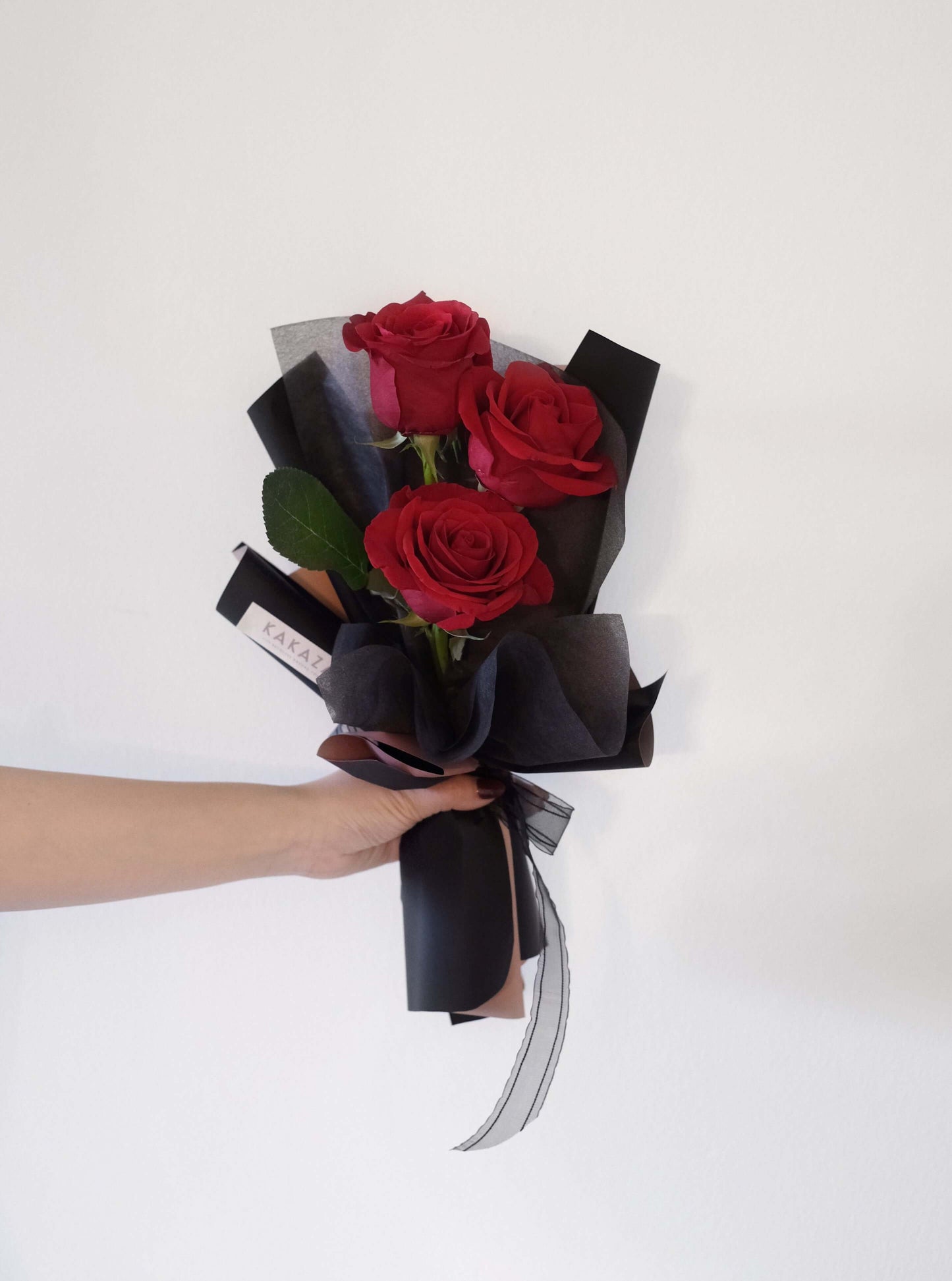 Holding Red Rose Bouquet